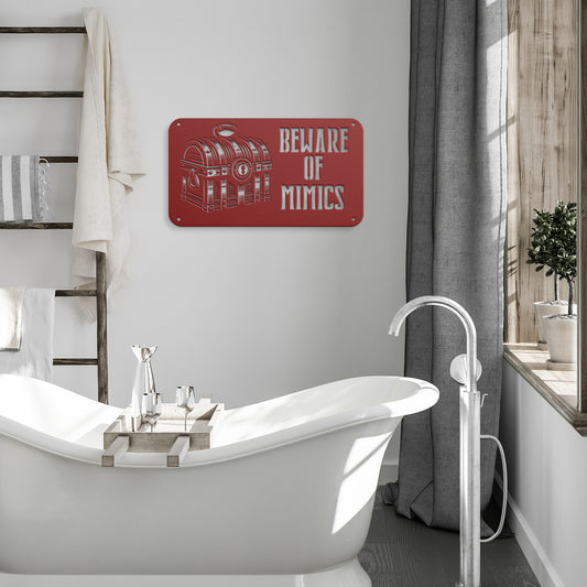 "Beware of Mimics" metal sign with a treasure chest graphic, playfully warning of hidden dangers. Ideal for TTRPG and gaming decor, made of 18-gauge steel and available in black, red, white, copper, or silver. Comes in six sizes ranging from 12 to 36 inches.