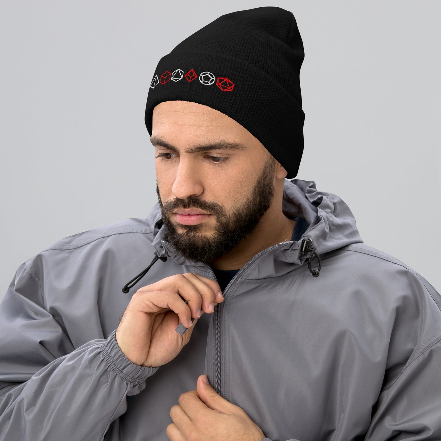 Man Wearing Unisex TTRPG Dice Beanie in Black with Embroidered Polyhedral Dice Design.