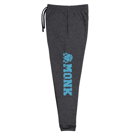 dnd monk joggers crafted from a luxurious blend of 60% cotton and 40% polyester pre-shrunk fleece, featuring a soft and durable fabric weight of 7.2 oz/yd² (244 g/m²). Designed with a tapered fit, lower rise in the front, and longer rise in the back for optimal movement. Includes an elastic waistband with external drawcord for a customizable fit, 1×1 rib cuffs with spandex for stretch and recovery, and stylish side pockets. The joggers are adorned with a bold 'monk' graphic on the left leg